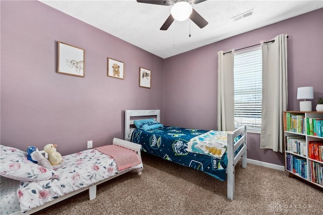 bedroom featuring multiple windows, carpet, and ceiling fan