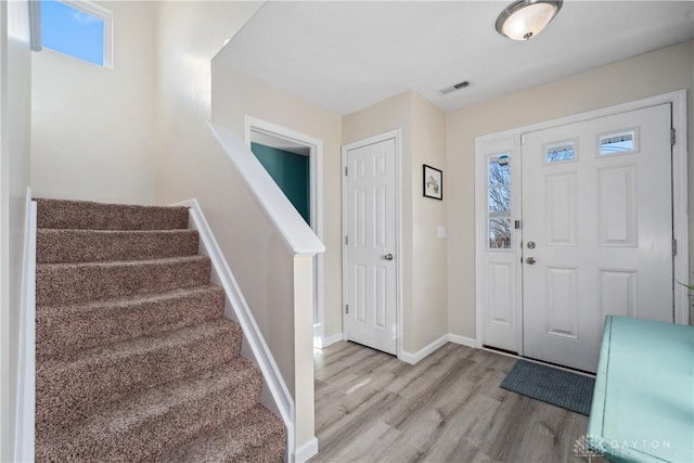 foyer entrance with light wood-type flooring