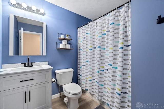 bathroom featuring a shower with curtain, vanity, toilet, and hardwood / wood-style floors