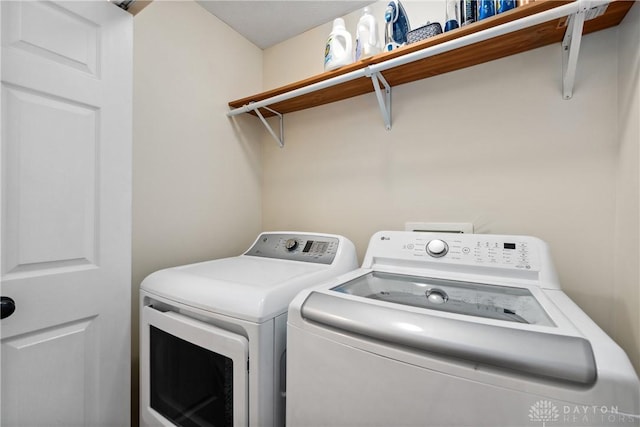 laundry room with washer and clothes dryer