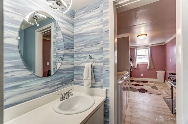 bathroom featuring vanity and ornamental molding