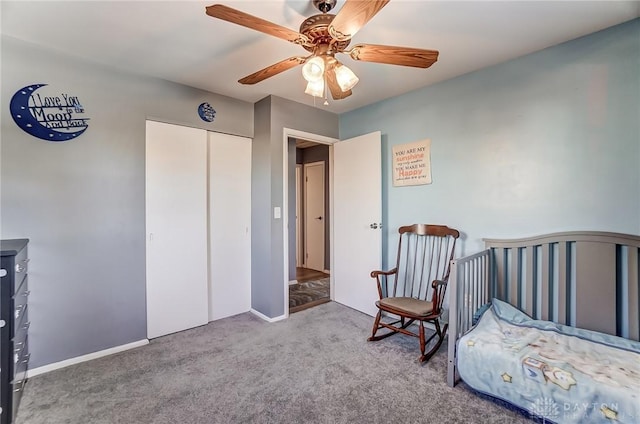 carpeted bedroom featuring a closet and ceiling fan