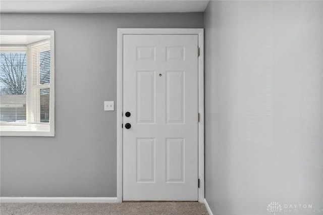 entryway with light carpet