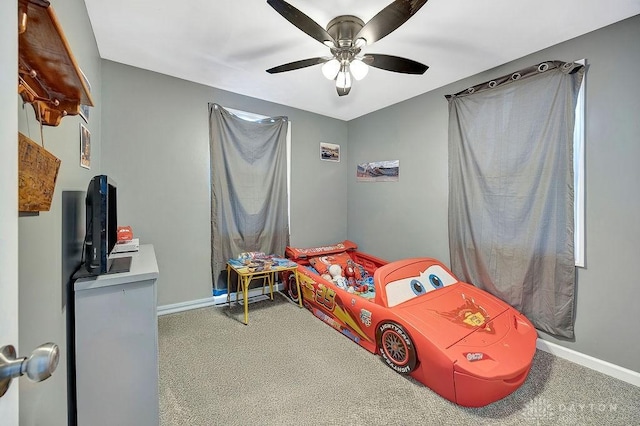 carpeted bedroom featuring ceiling fan