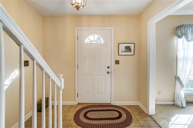 entryway with light tile patterned floors