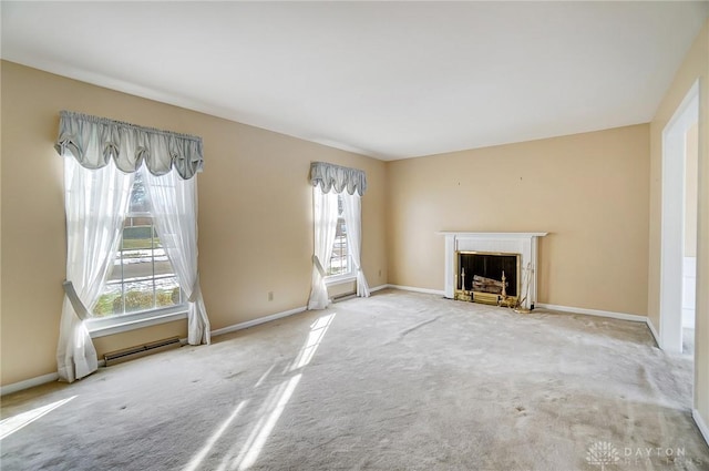 unfurnished living room with a baseboard radiator and carpet flooring