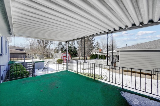 view of patio / terrace featuring a shed