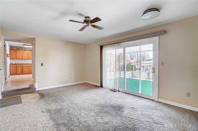 unfurnished living room with ceiling fan and light colored carpet