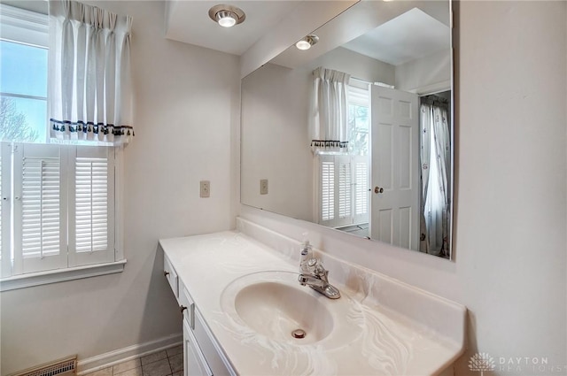 bathroom with vanity, tile patterned flooring, and plenty of natural light