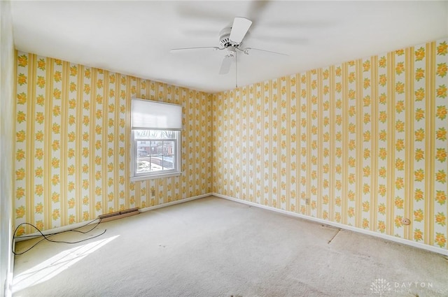 carpeted empty room with ceiling fan