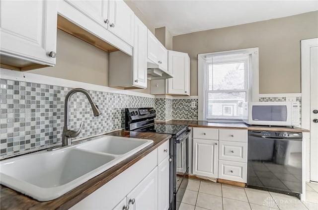 kitchen featuring white cabinetry, light tile patterned floors, sink, and black appliances