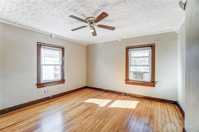 unfurnished room with cooling unit, crown molding, ceiling fan, and light wood-type flooring