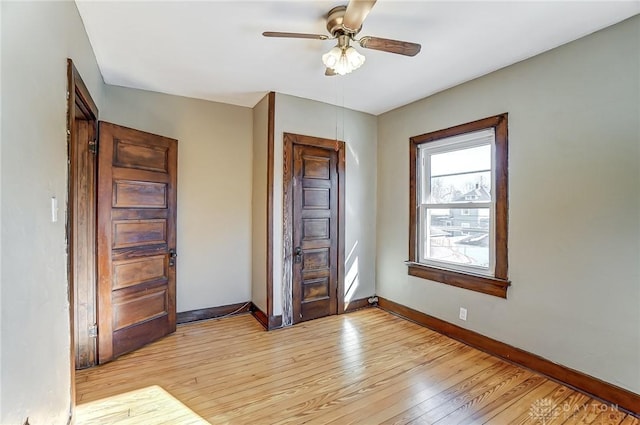 unfurnished room featuring ceiling fan and light wood-type flooring