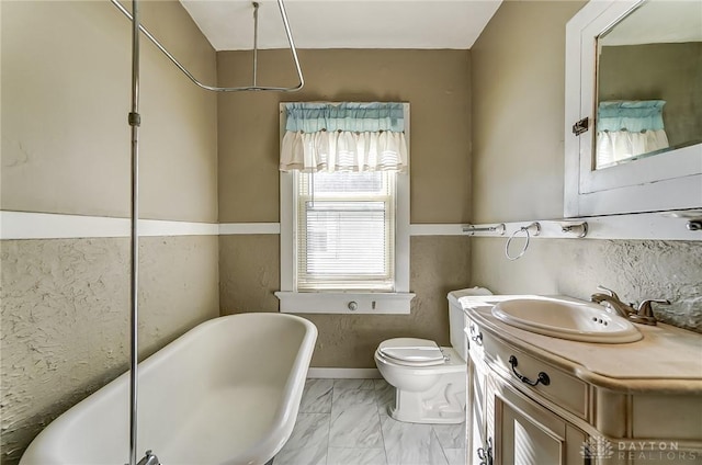 bathroom featuring vanity, toilet, and a bathtub