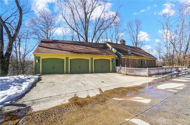 view of side of property with a garage