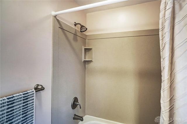 bathroom featuring shower / bathtub combination with curtain