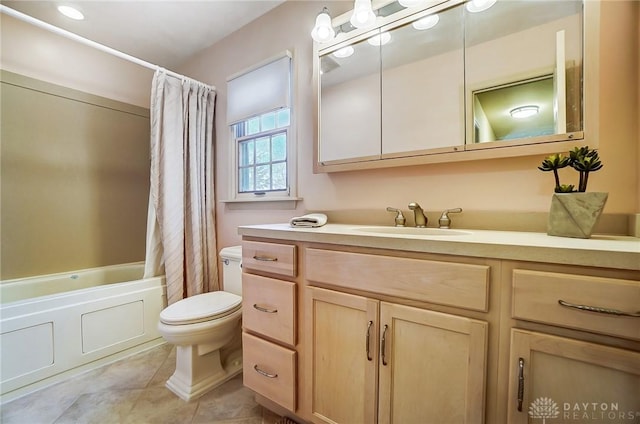 full bathroom featuring toilet, tile patterned floors, vanity, and shower / bathtub combination with curtain