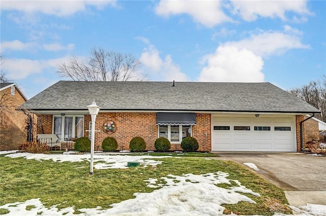 view of front of home featuring a garage and a front lawn