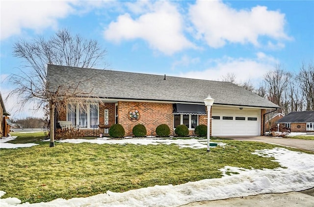 single story home featuring a garage and a front lawn