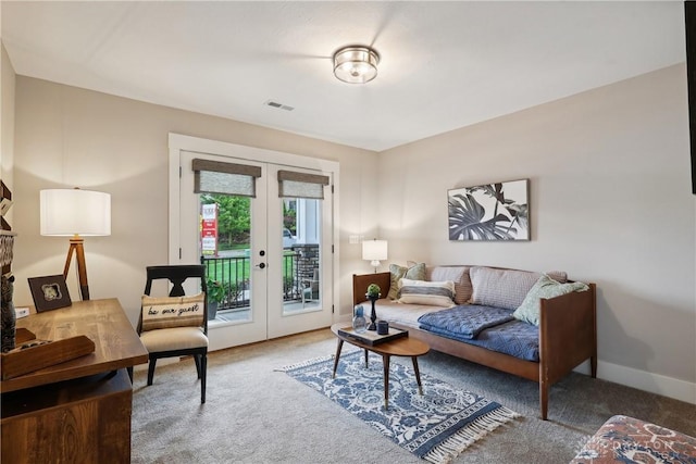 carpeted living room featuring french doors