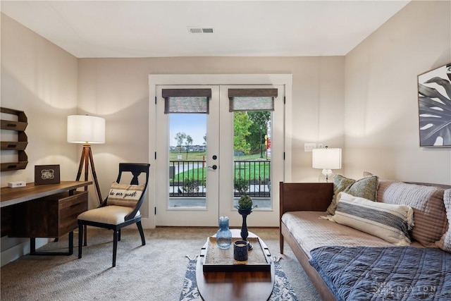 living area with french doors and carpet