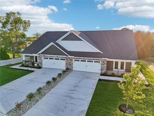 craftsman-style home with a porch, a garage, and a front yard