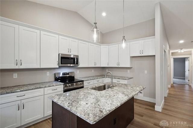 kitchen featuring white cabinetry, sink, a center island with sink, and appliances with stainless steel finishes