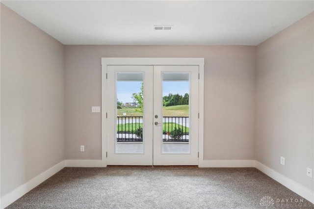 doorway featuring a water view, carpet floors, and french doors