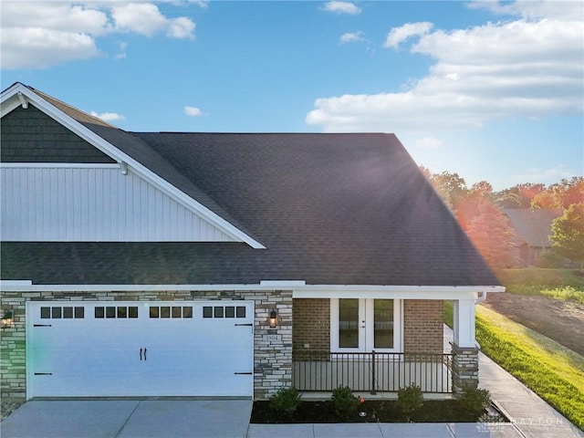 view of front of property featuring a garage and french doors