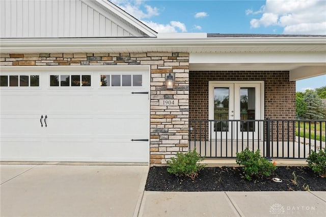 doorway to property with a garage