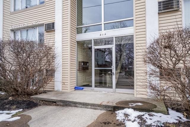 view of snow covered property entrance