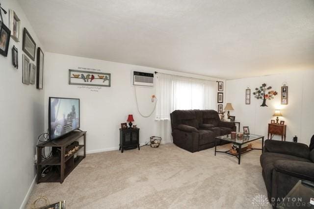 living room featuring light colored carpet and a wall unit AC