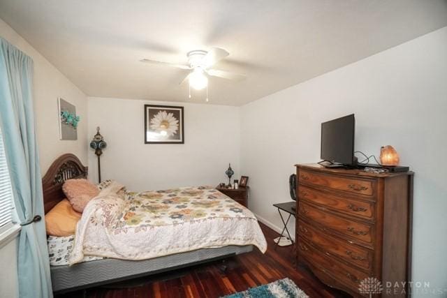 bedroom with ceiling fan and dark hardwood / wood-style flooring