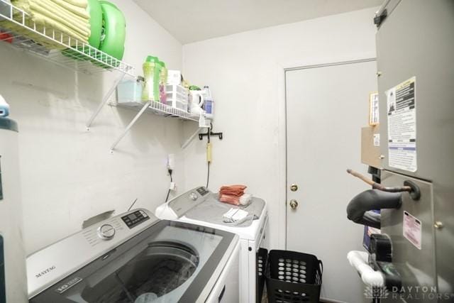 clothes washing area with washer and dryer