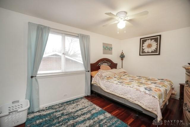 bedroom featuring ceiling fan and dark hardwood / wood-style flooring