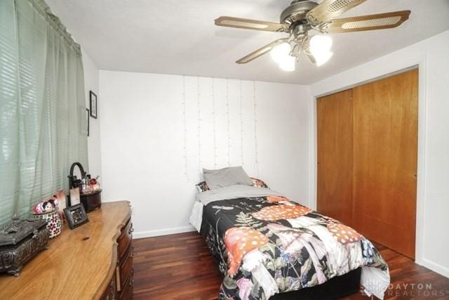 bedroom featuring ceiling fan and dark hardwood / wood-style floors