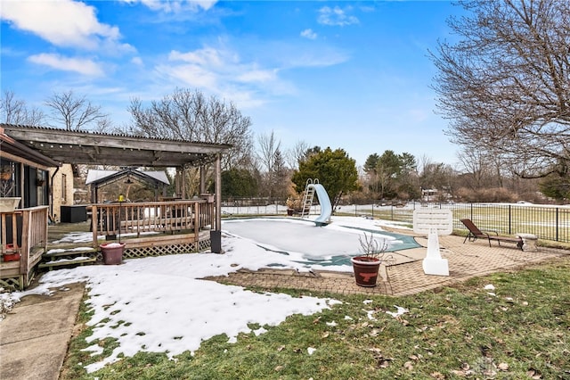 view of yard with a pergola, a patio area, and a swimming pool side deck