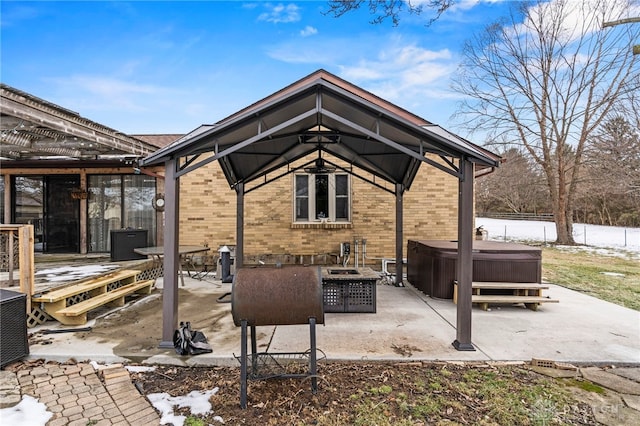 view of patio featuring a hot tub