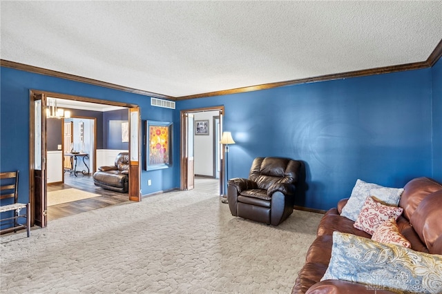 unfurnished living room with ornamental molding, carpet floors, and a textured ceiling