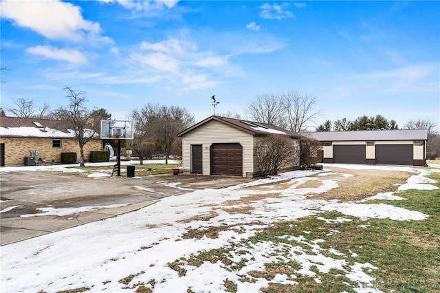 view of front of home with an outbuilding and a garage