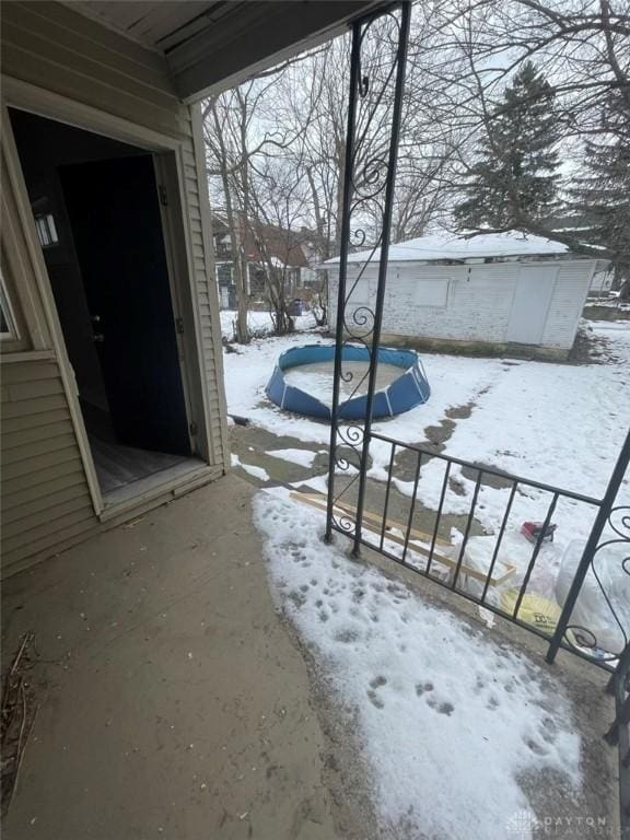 view of snow covered patio