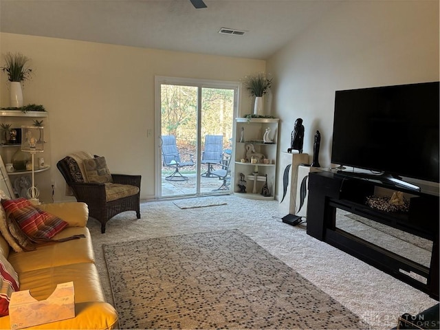 living room with vaulted ceiling and carpet