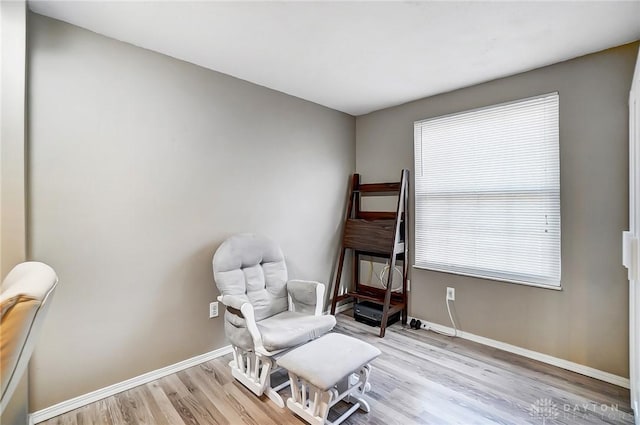 living area with light hardwood / wood-style floors