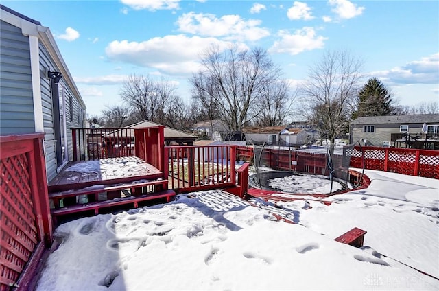 view of snow covered deck