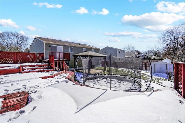 exterior space with a gazebo, a trampoline, and a shed