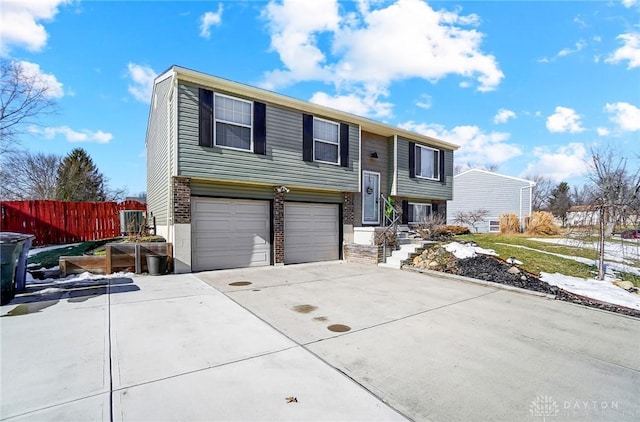 split foyer home featuring a garage