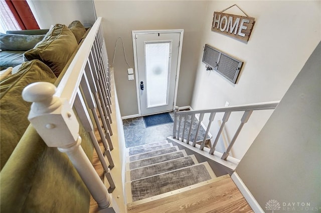 stairway featuring hardwood / wood-style floors