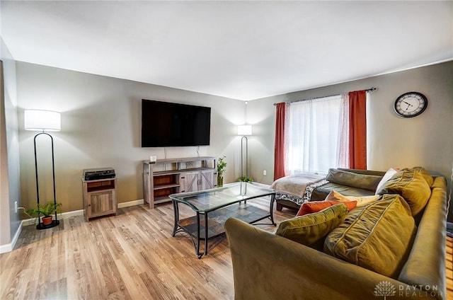 living room with light hardwood / wood-style flooring