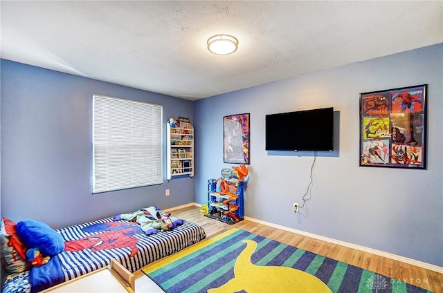 bedroom featuring hardwood / wood-style floors