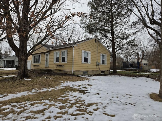 view of snow covered property